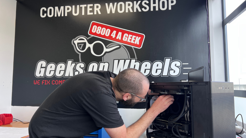 Technician fixing computer